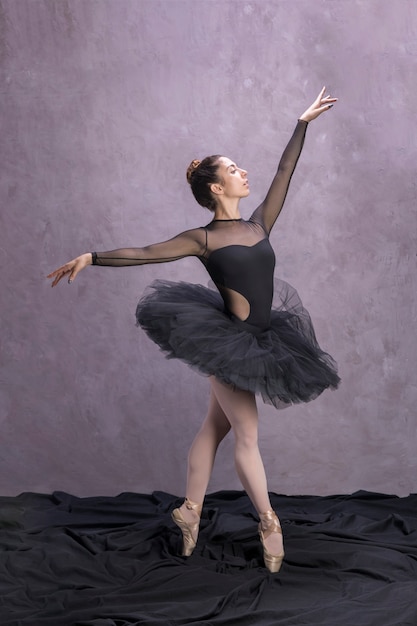 Free photo side view ballerina posing in tutu