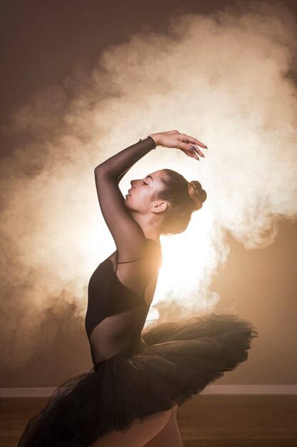 Side view ballet posture in smoke