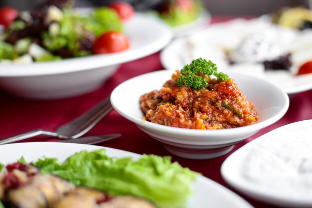 Side view barbecue salad on a served table