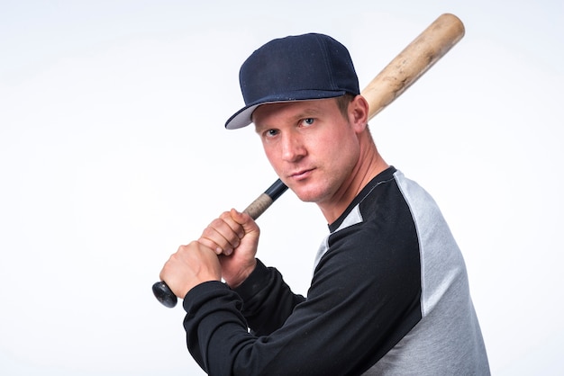 Side view of baseball player holding bat