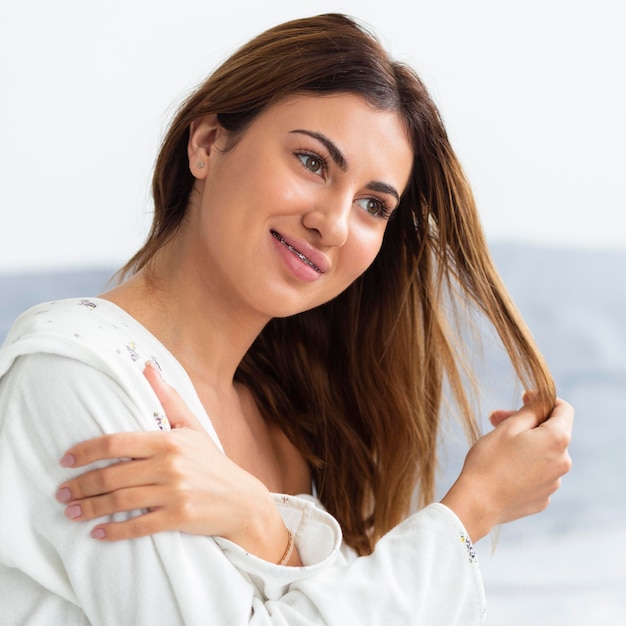 Side view of beautiful woman in bathrobe