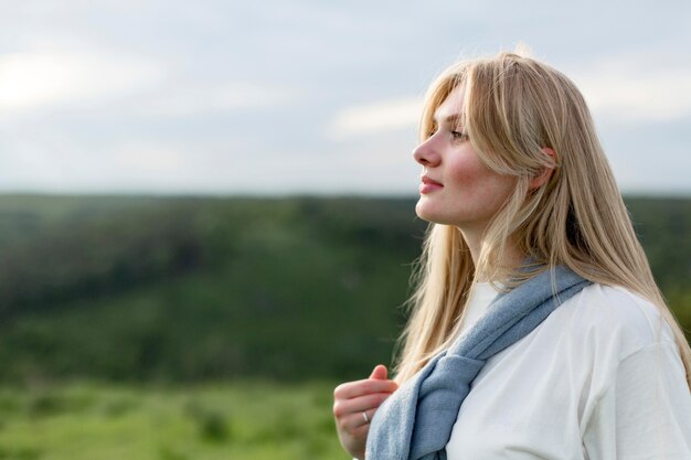 Side view of beautiful woman posing in nature