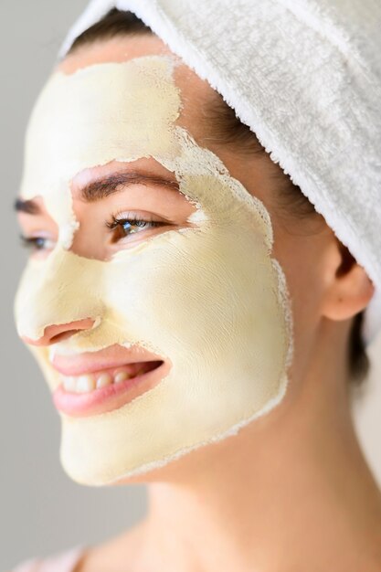 Side view of beautiful woman wearing face mask