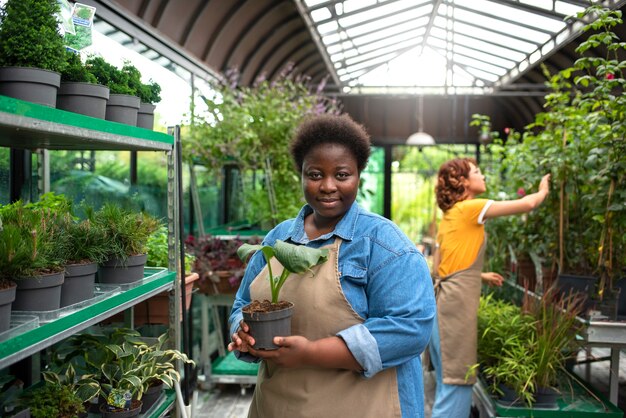 Side view black woman running a flower business