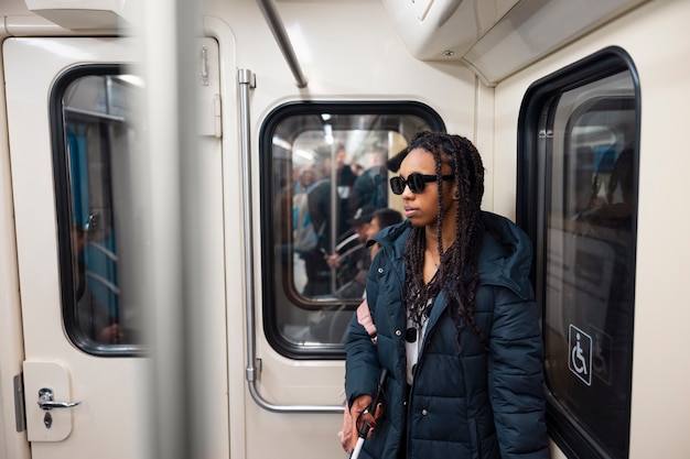 Side view blind woman traveling alone