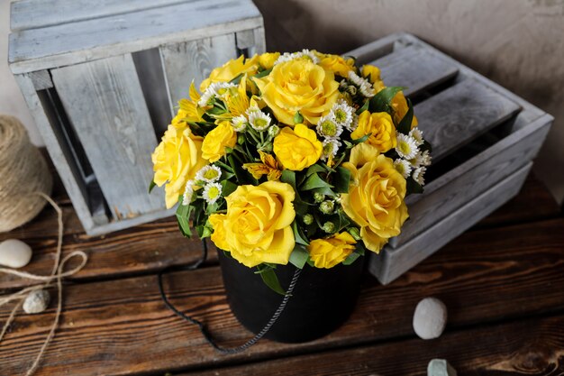 Side view bouquet of yellow roses on the table