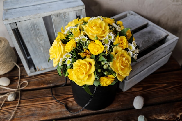 Side view bouquet of yellow roses on the table