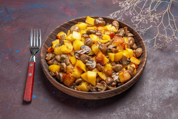 Side view bowl of potatoes and mushrooms bowl of potatoes and mushrooms and a fork