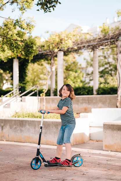 Side view of boy playing in park