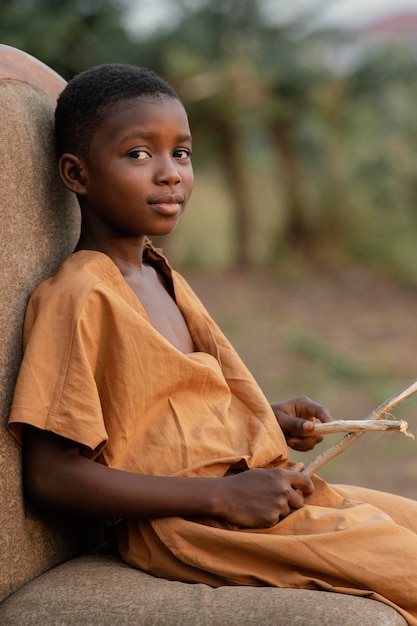 Side view boy with drum sticks