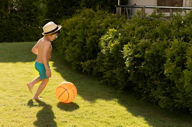 Side view boy with hat and sunglasses