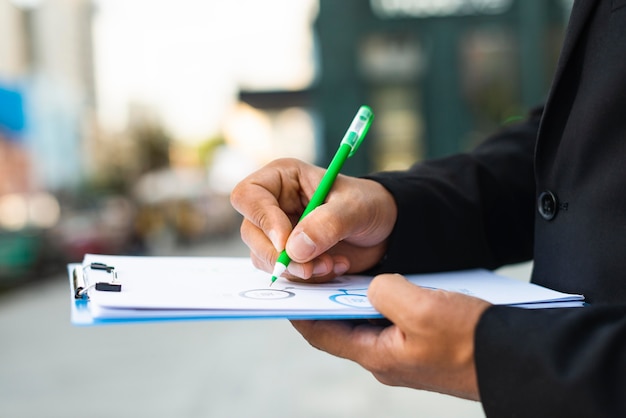 Side view business man writing