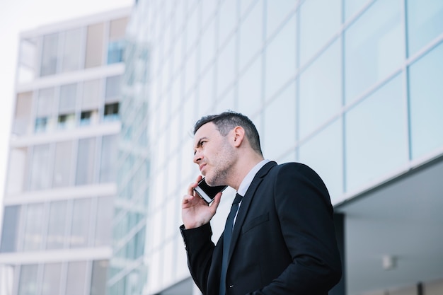 Side view of business person phoning