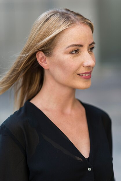 Side view of business woman portrait outdoors