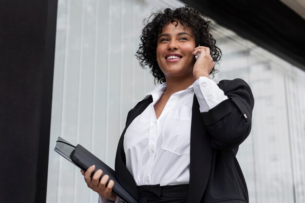 Side view business woman talking on phone