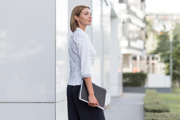 Side view business woman with file