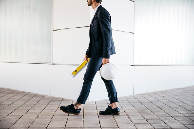 Side view of businessman at corner