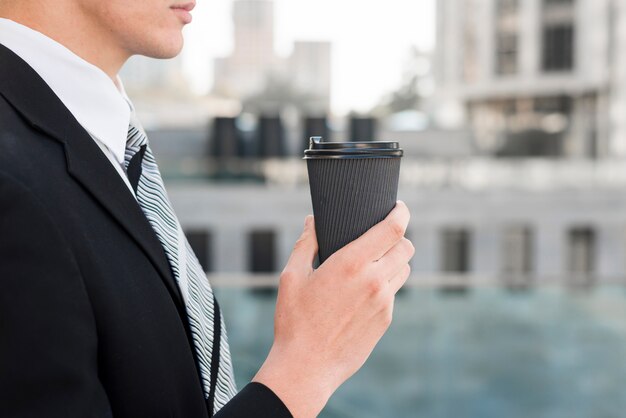 Side view of businessman with coffee