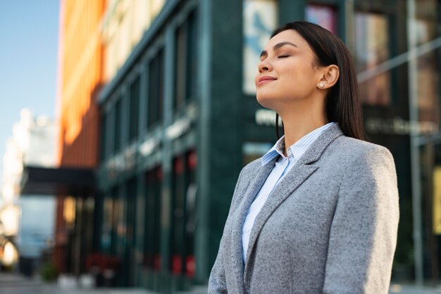 side view of businesswoman outdoors in the city