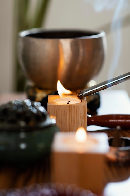 Side view of candles for prayer being lit