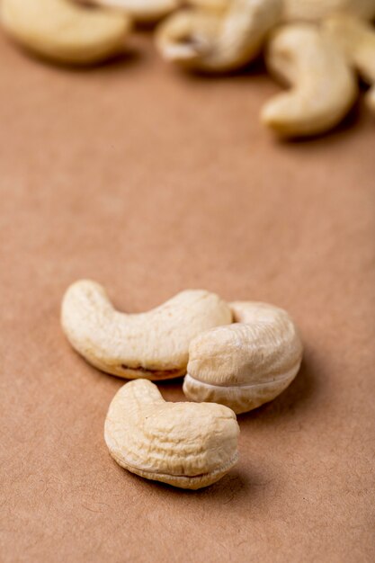 Side view of cashews isolated on old paper texture background