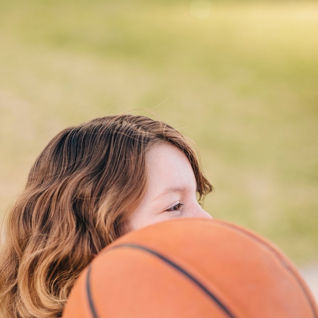 Side view of child and ball