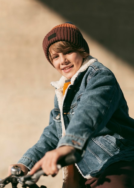 Side view of child on bike outdoors