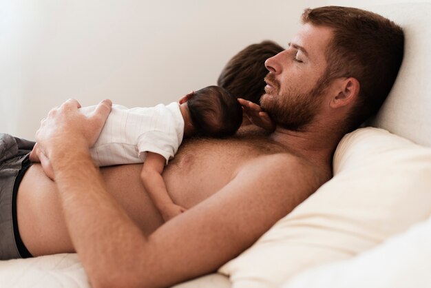 Side view children and father sleeping together