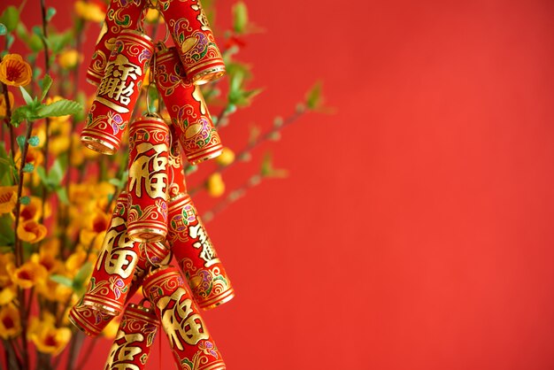 Side view of Chinese New Year decoration hanging at the red background