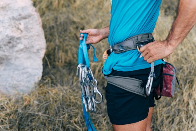 Side view of climber holding rope