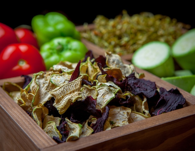 Side view close-up dried vegetables in wooden box