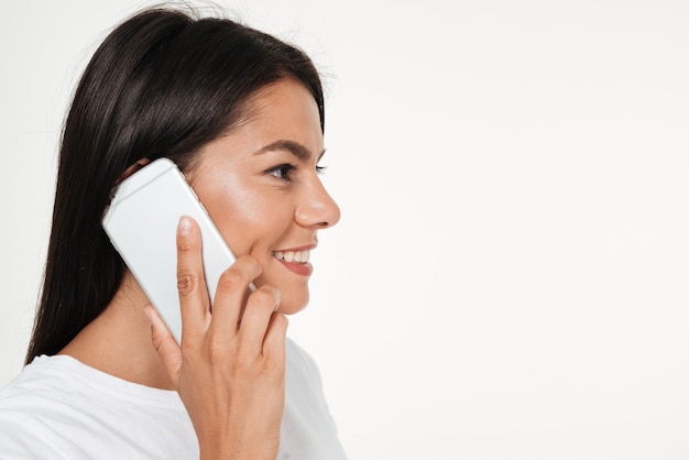 Side view close up portrait of a smiling brunette woman