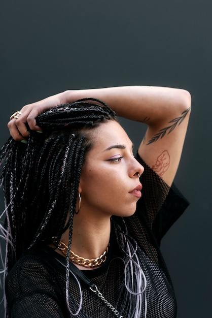 Informal young female with colored braids hairdo and spooky black stage  makeup painted on face 32500499 Stock Photo at Vecteezy