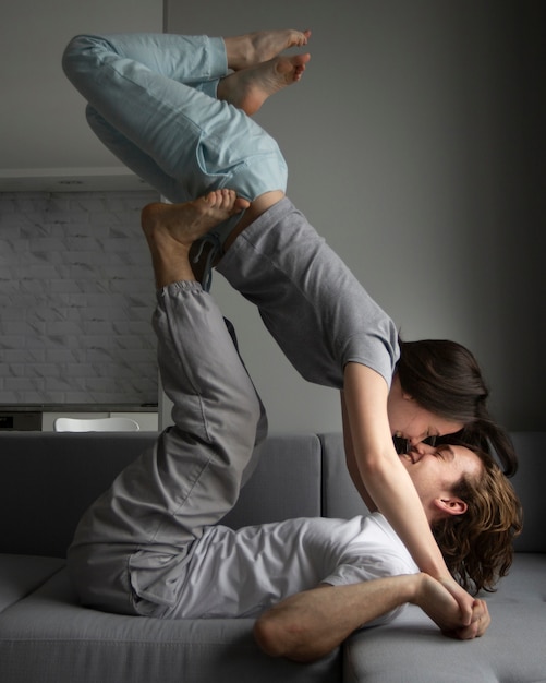 Side view of couple doing weird poses