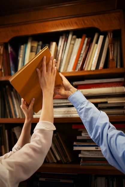 Side view couple having a bookstore date