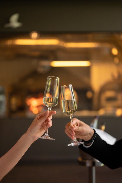 Side view couple holding drinks