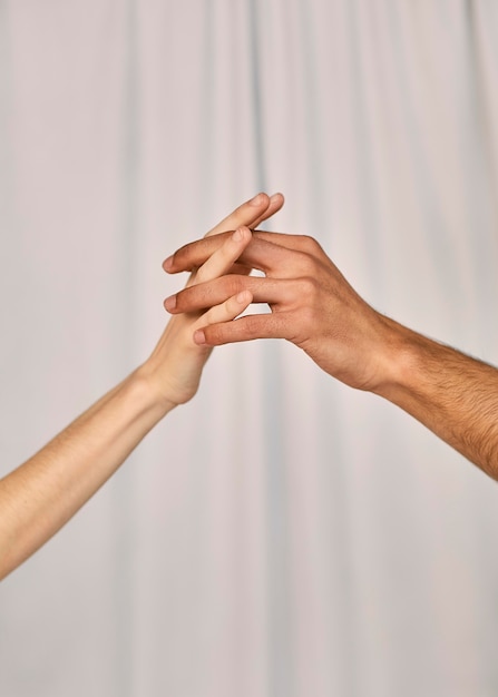 Free photo side view of couple holding hands