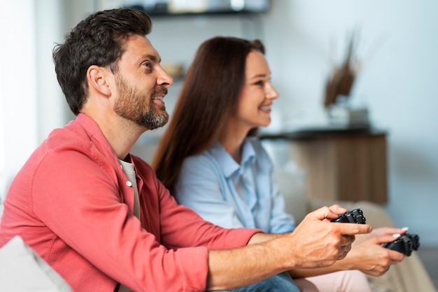 Side view couple playing videogame