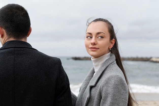 Side view couple at seaside