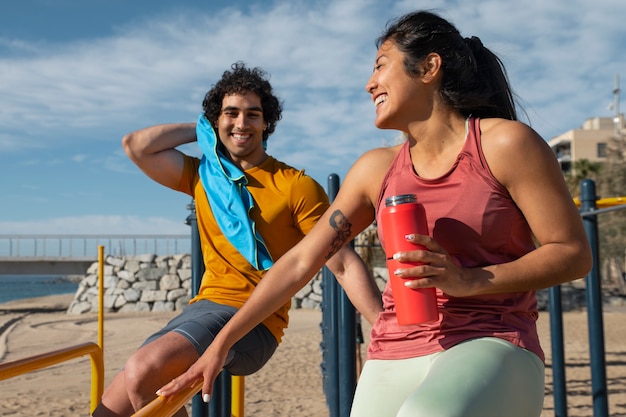 Side view couple training outdoors