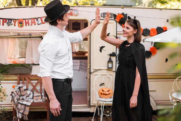 Side view couple wearing costumes