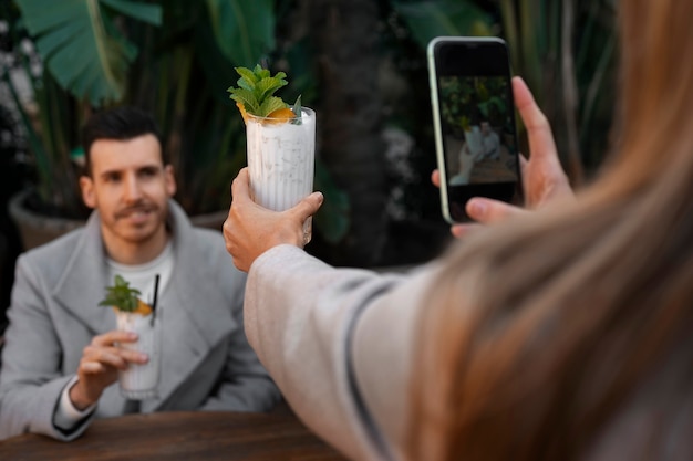 Side view couple with pina colada