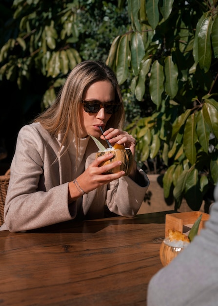 Side view couple with pina colada