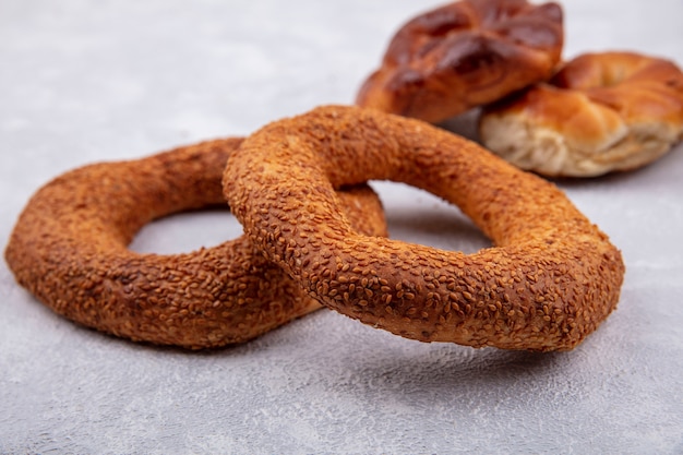 Side view of crispy and delicious sesame turkish bagels on a white background