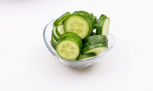 Side view cucumber sliced in glass bowl
