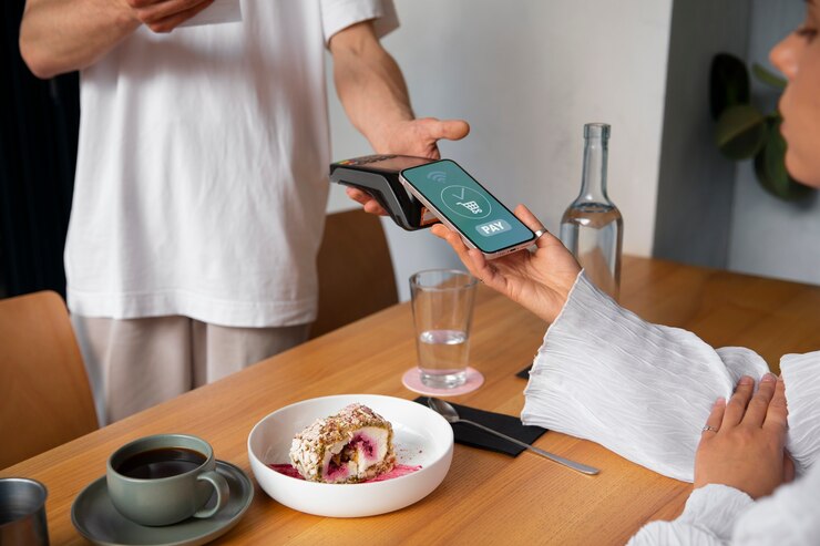 Free Photo side view customer paying with nfc device