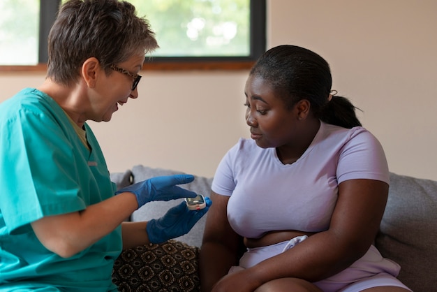 side view diabetic woman checking her glucose level