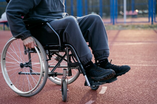 Side view disabled man in wheelchair