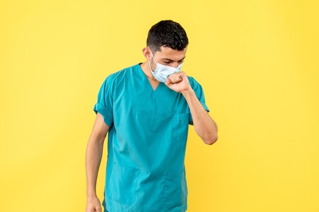 Side view of a doctor in the blue medical uniform coughs