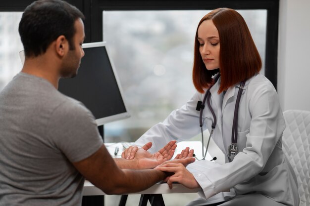 Side view doctor checking patient